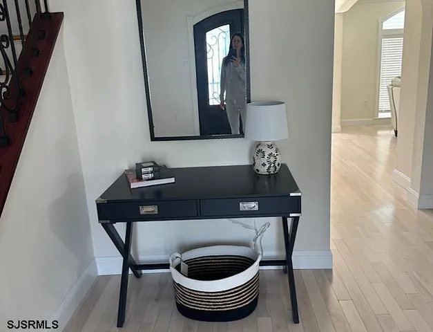 a bathroom with a toilet a sink and a mirror