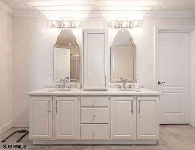a bathroom with a double vanity sink and a mirror