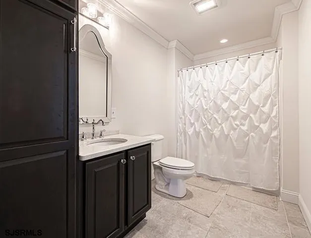 a living room with furniture and flat screen tv