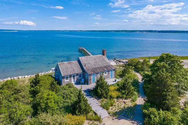 a view of a lake with a house in the background