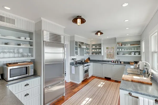 a kitchen with refrigerator and stove