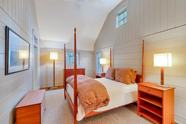 a dining area with stainless steel appliances a table and chairs in it