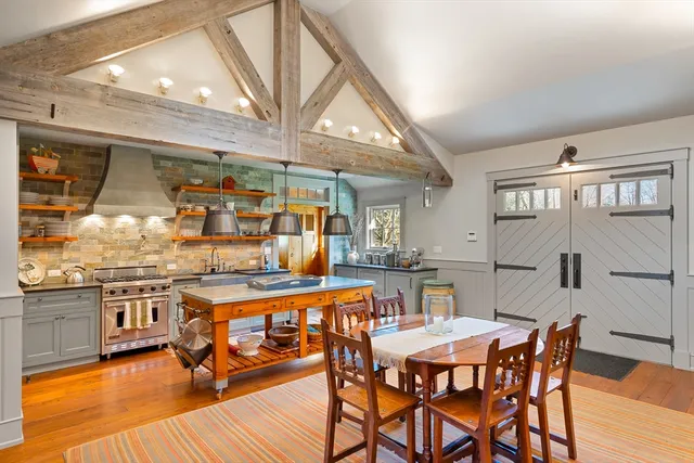 a kitchen with a sink and wooden floor