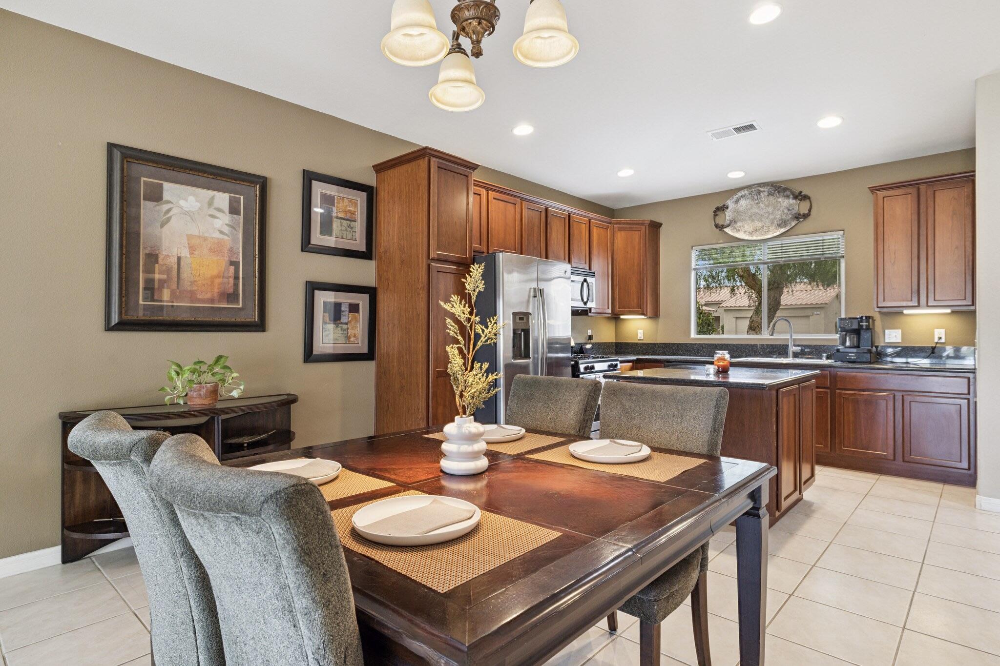 49151 Biery Street Indio, CA 92201 - Photo 12 of 26 a kitchen with a dining table and chairs