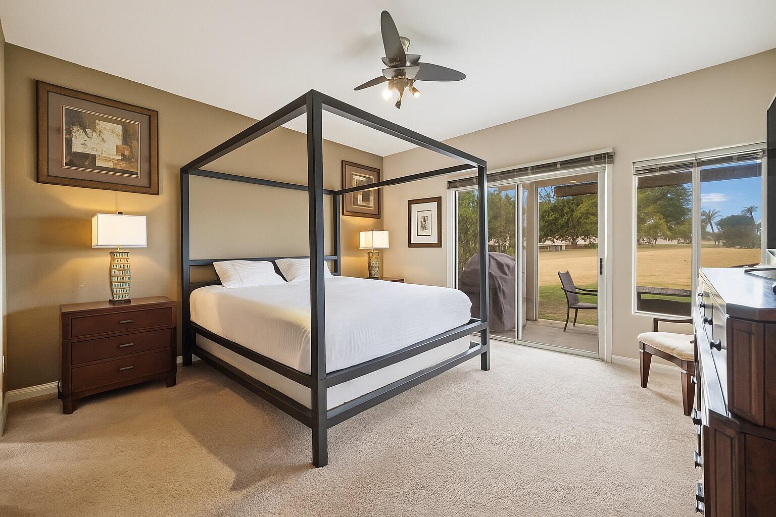 49151 Biery Street Indio, CA 92201 - Photo 15 of 26 a bedroom with a bed and a tv on the dresser