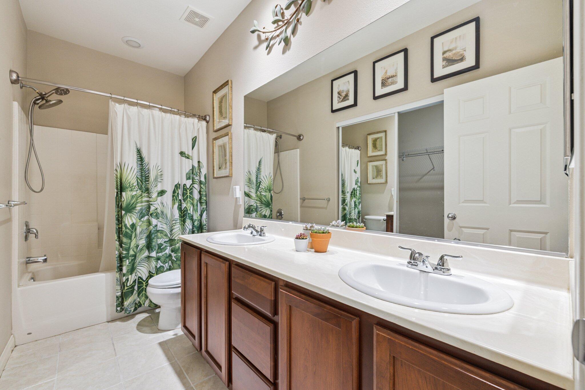 49151 Biery Street Indio, CA 92201 - Photo 16 of 26 a bathroom with a sink and a mirror