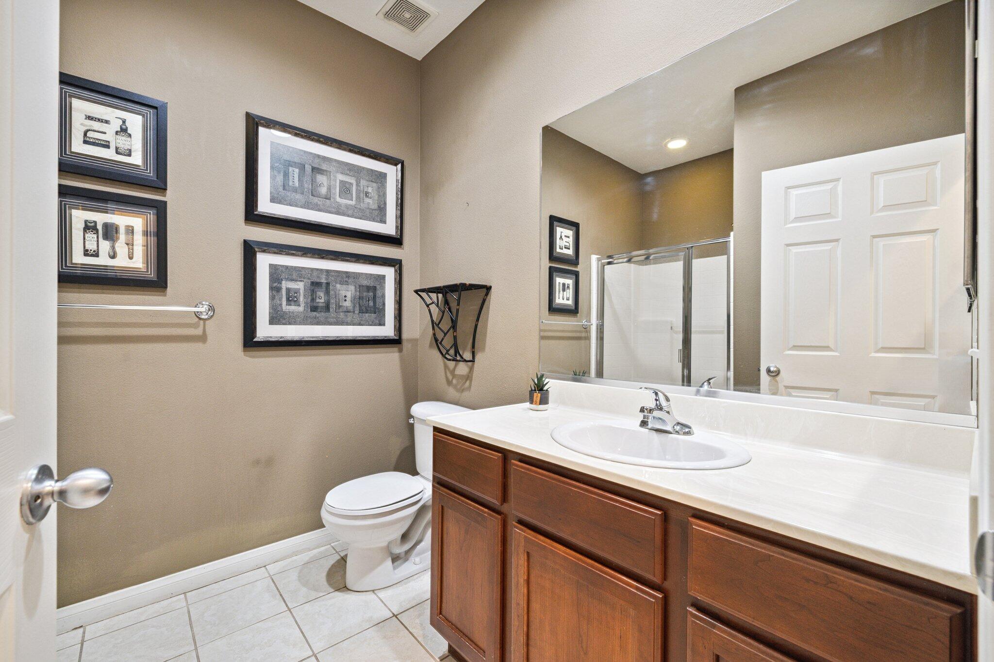 49151 Biery Street Indio, CA 92201 - Photo 18 of 26 a bathroom with a sink a toilet and mirror