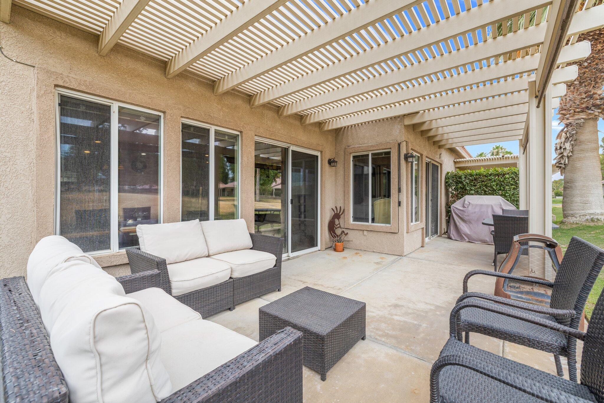 49151 Biery Street Indio, CA 92201 - Photo 22 of 26 a living room with furniture and a large window