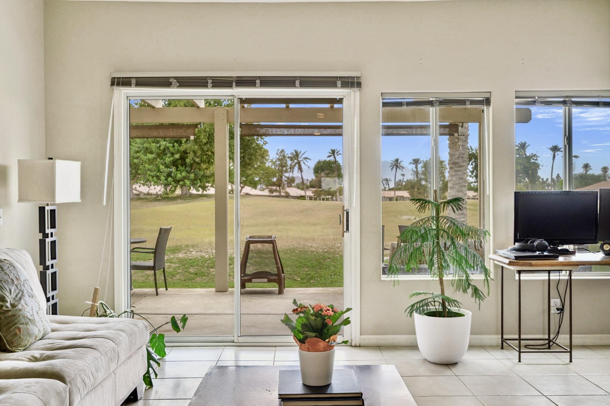 49151 Biery Street Indio, CA 92201 - Photo 4 of 26 a living room with furniture and a potted plant