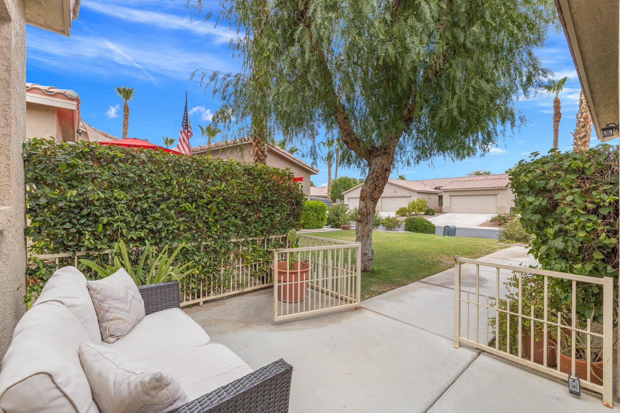 49151 Biery Street Indio, CA 92201 - Photo 7 of 26 a view of a patio with a yard