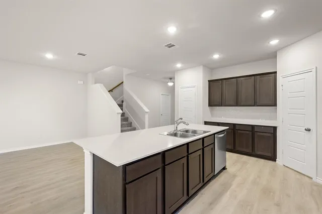 a view of a kitchen with electric appliances