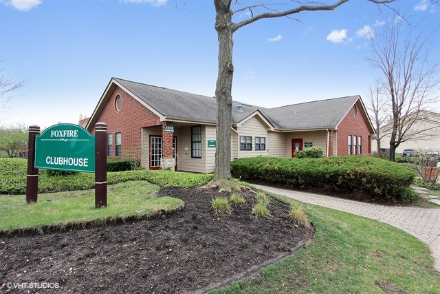 2028 North Rand Road, Unit 201 Palatine, IL 60074 - Photo 12 of 12 a front view of a house with a yard