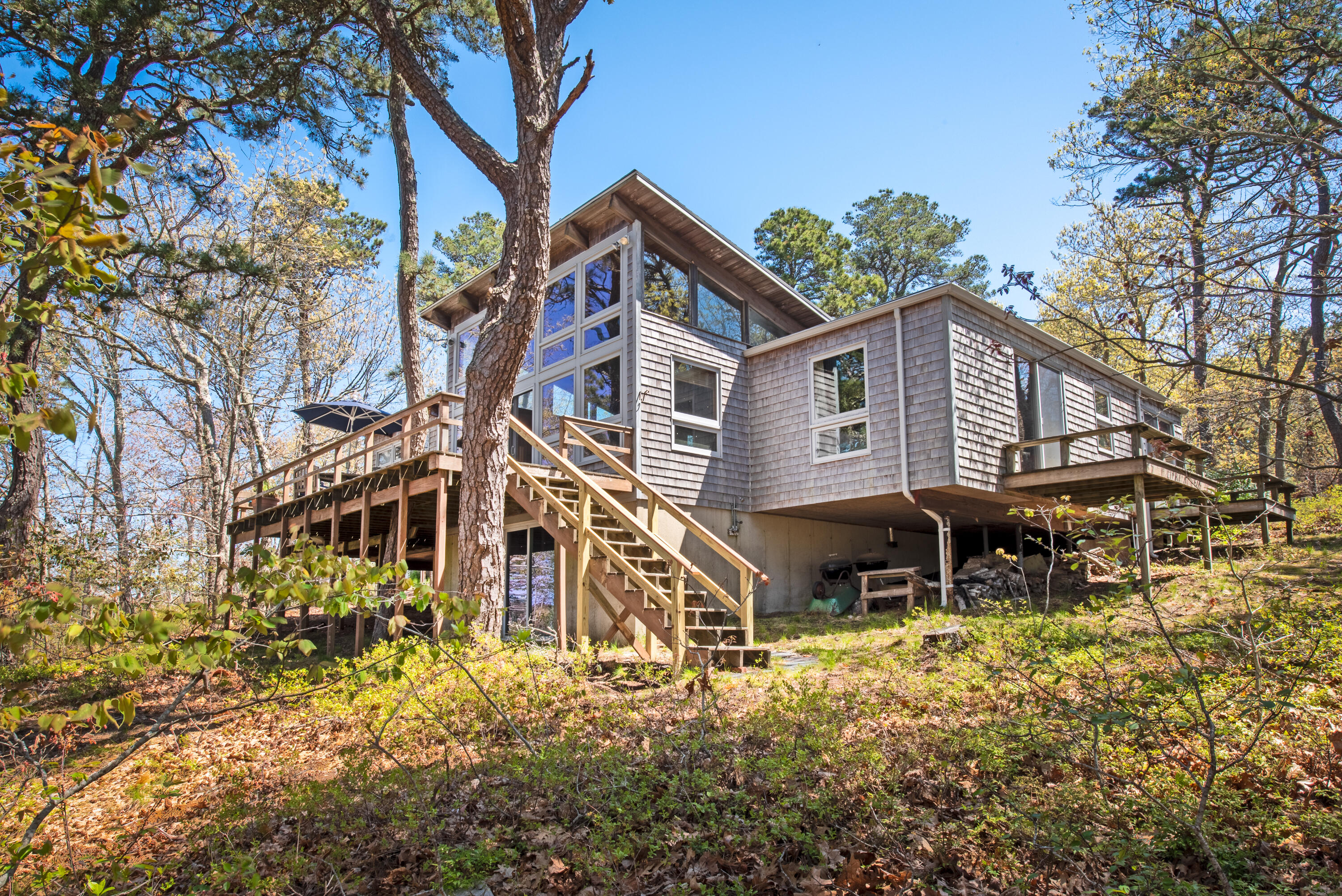 a view of a house with a yard and sitting area