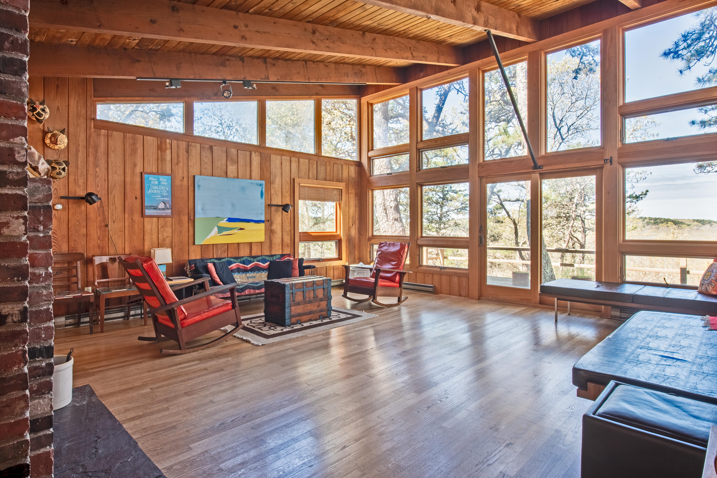 1162 Browns Neck Road Wellfleet, MA 02667 - Photo 12 of 30 a living room with furniture and floor to ceiling windows