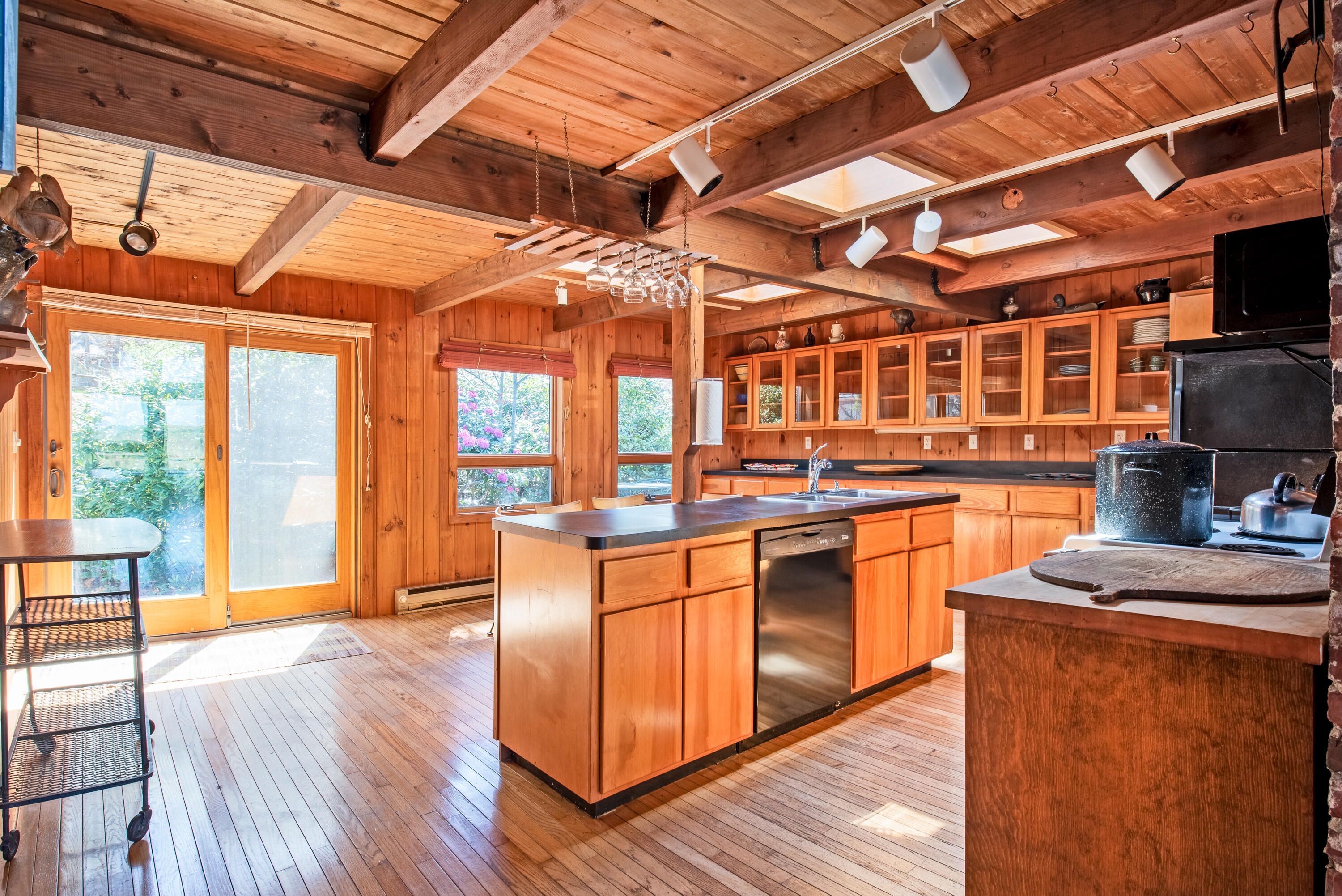 1162 Browns Neck Road Wellfleet, MA 02667 - Photo 15 of 30 a kitchen with stainless steel appliances granite countertop wooden floors a stove a sink and a microwave