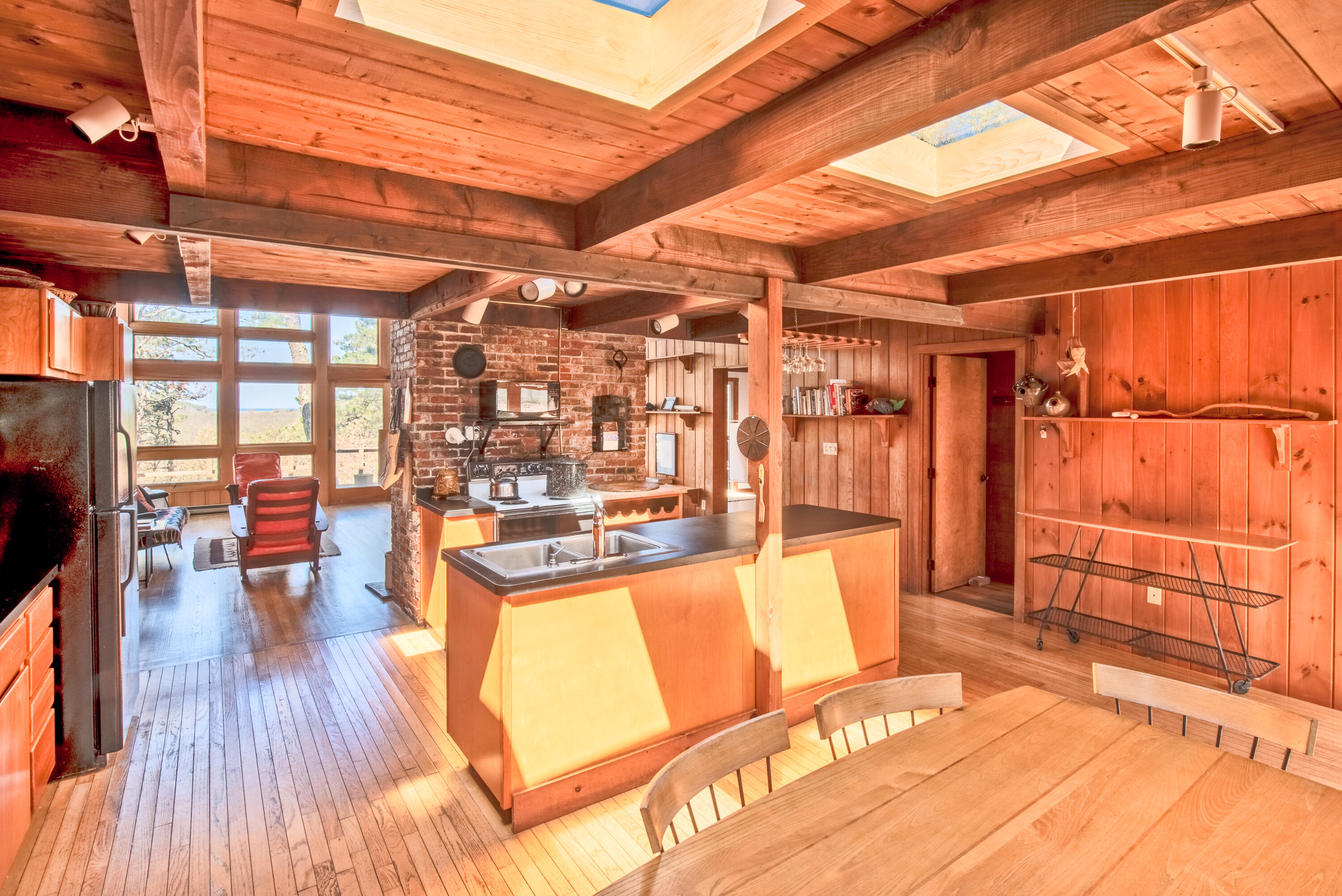 1162 Browns Neck Road Wellfleet, MA 02667 - Photo 18 of 30 a swimming pool with outdoor seating and wooden floor