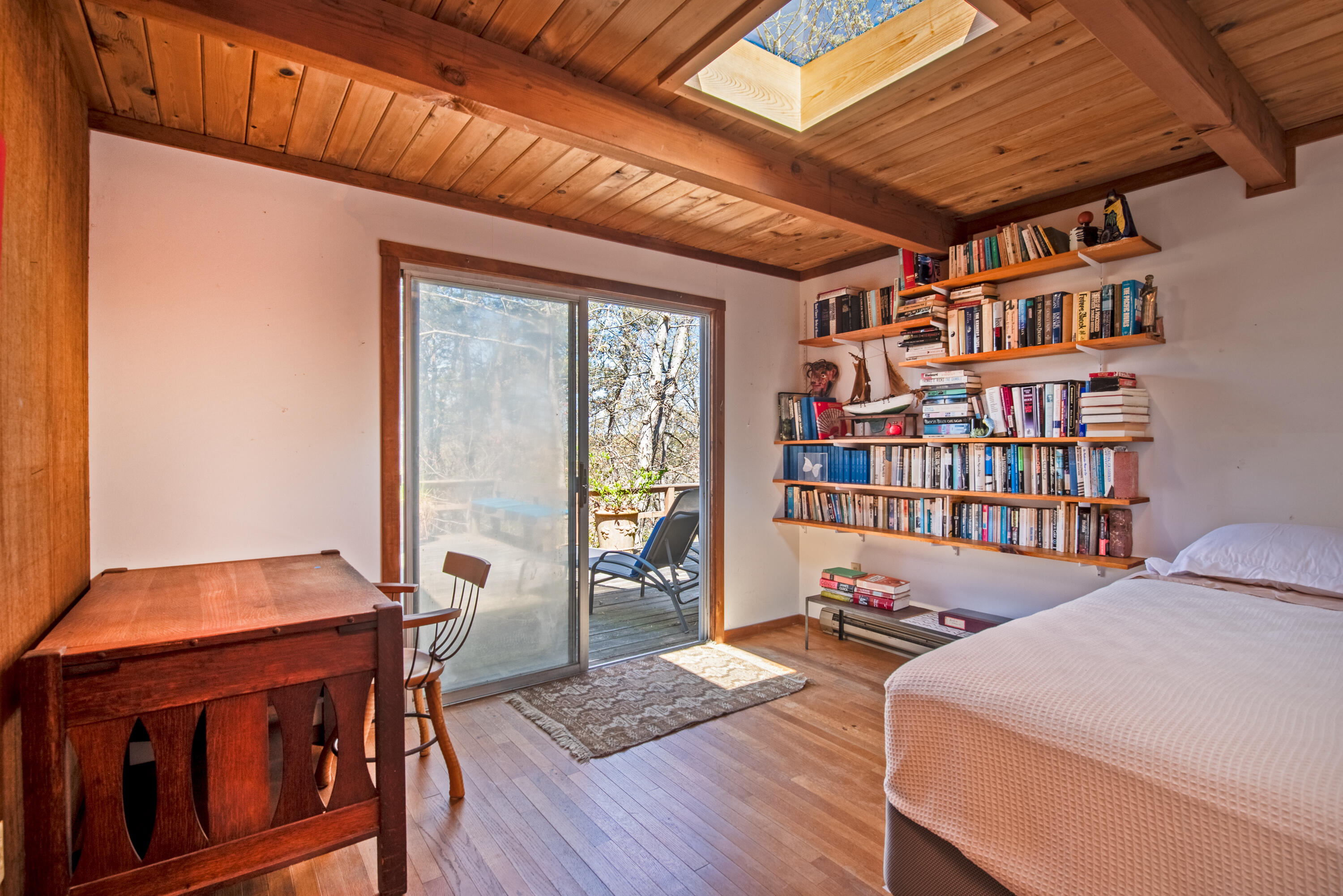 1162 Browns Neck Road Wellfleet, MA 02667 - Photo 23 of 30 a livingroom with furniture and a book shelf