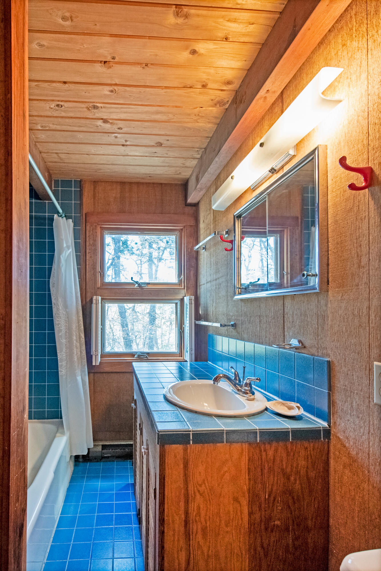 1162 Browns Neck Road Wellfleet, MA 02667 - Photo 26 of 30 a dining room with a sink and wooden floor