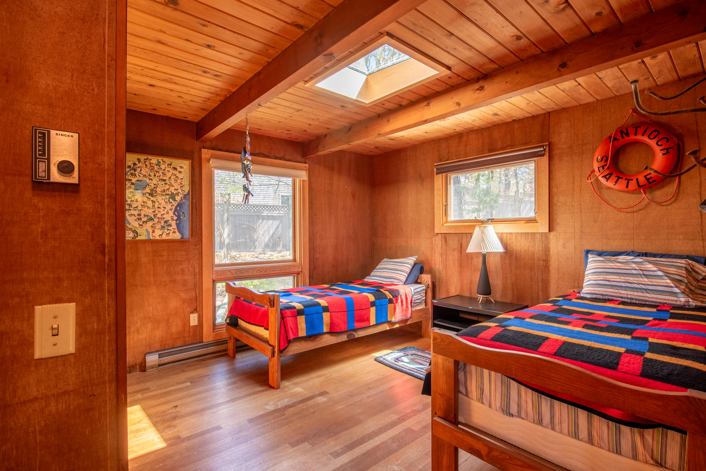 1162 Browns Neck Road Wellfleet, MA 02667 - Photo 27 of 30 a bedroom with a bed and wooden floor