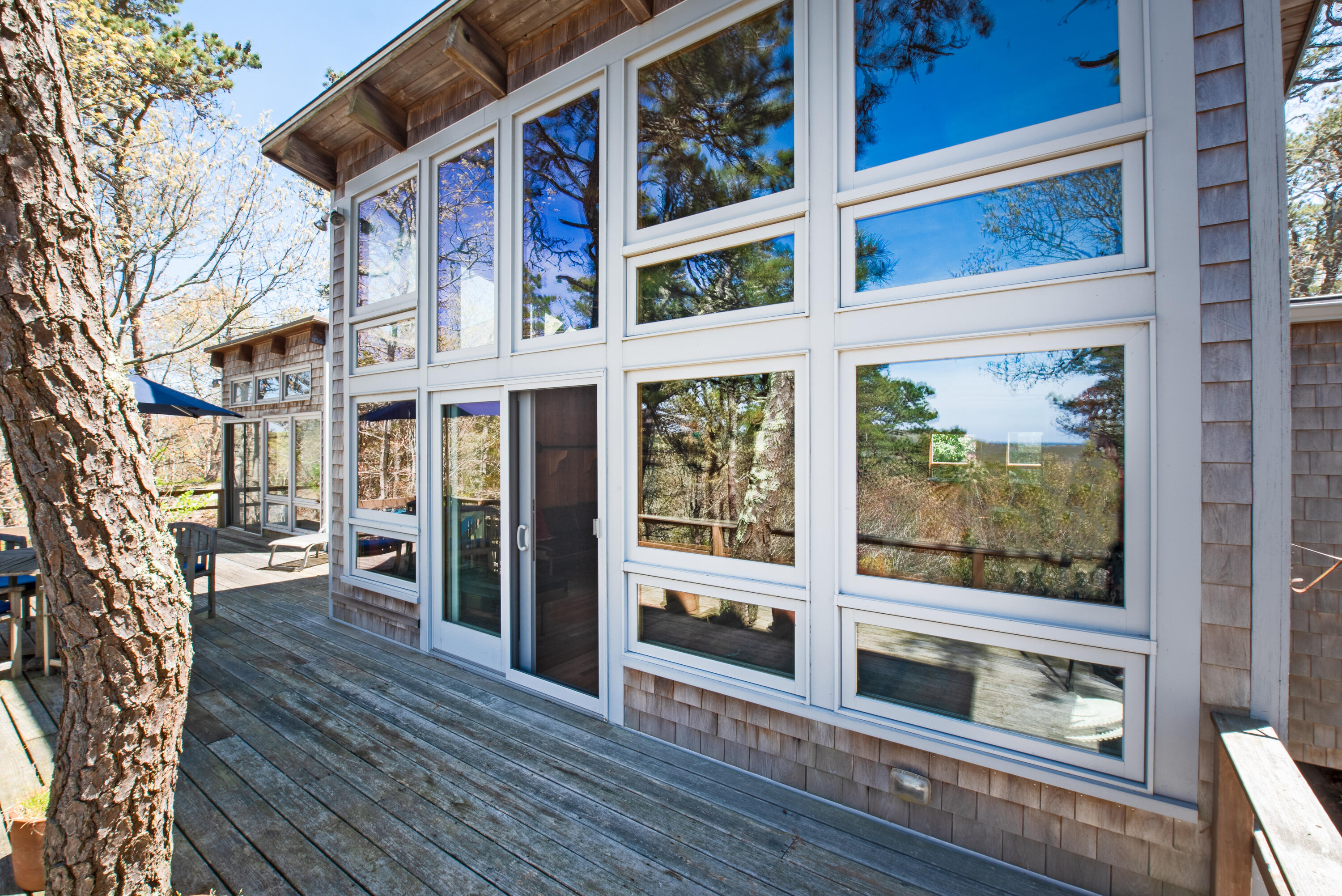 1162 Browns Neck Road Wellfleet, MA 02667 - Photo 7 of 30 a view of a brick house with a large window