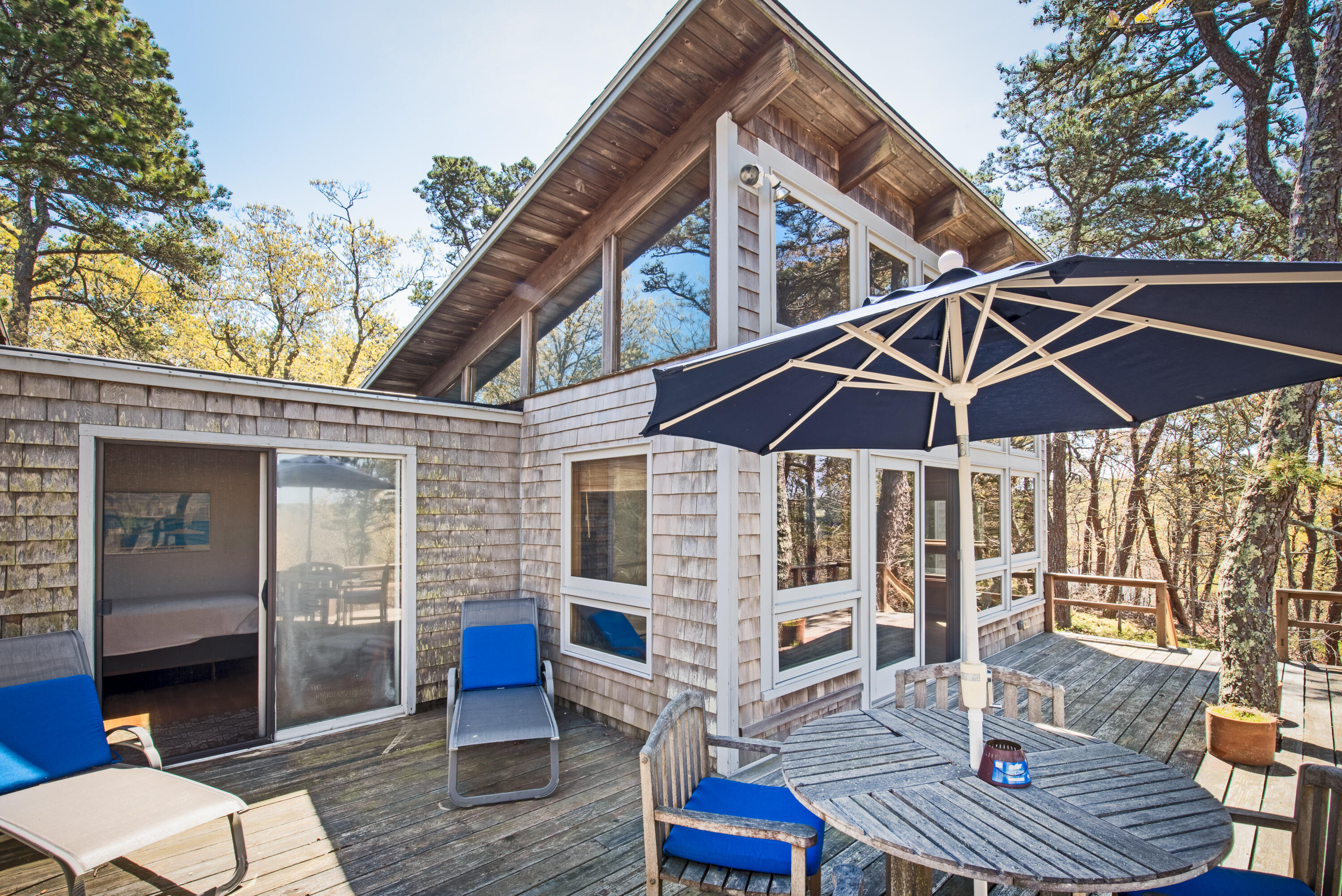 1162 Browns Neck Road Wellfleet, MA 02667 - Photo 8 of 30 a patio with tables and chairs