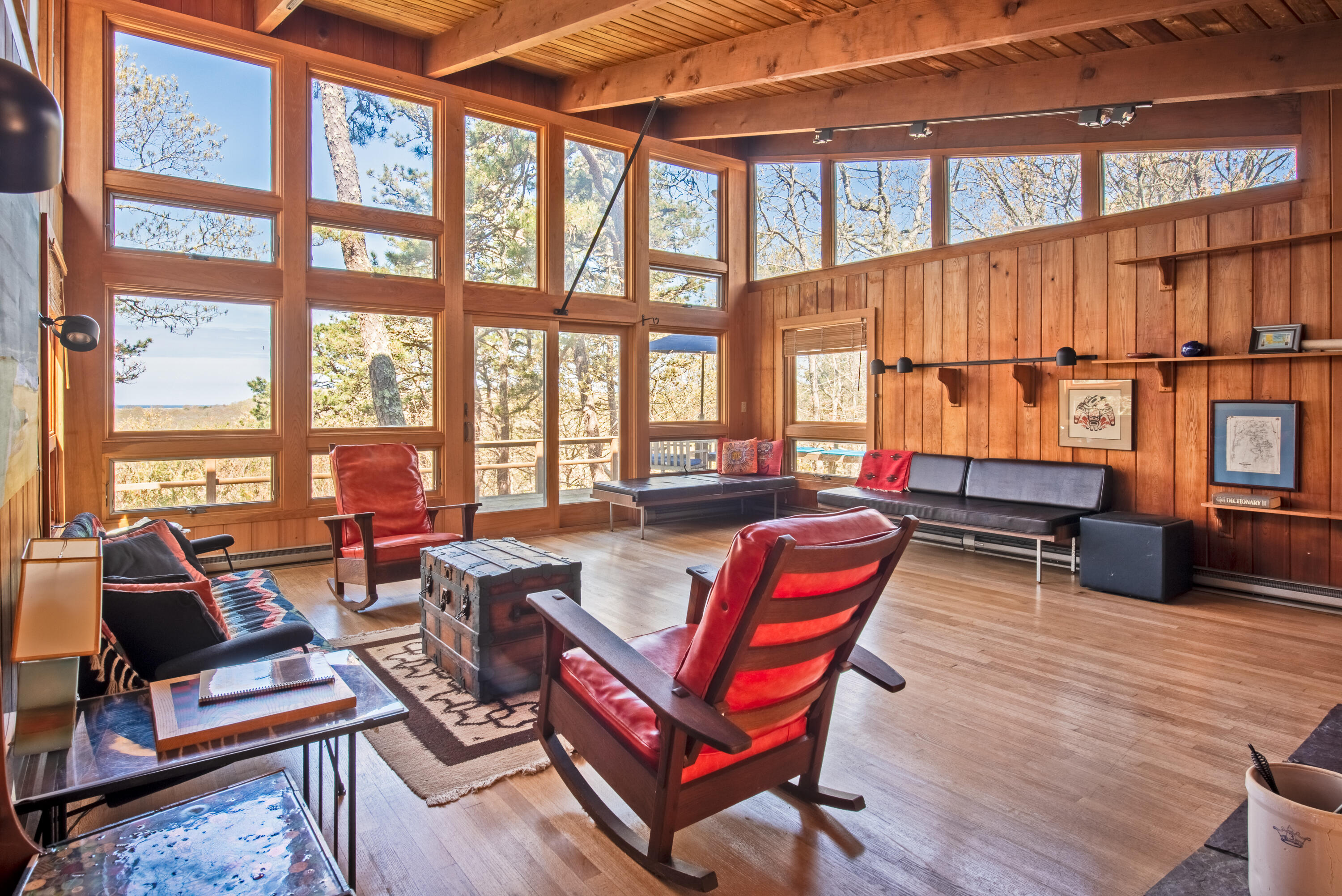 1162 Browns Neck Road Wellfleet, MA 02667 - Photo 10 of 30 a living room with furniture a rug and a floor to ceiling window
