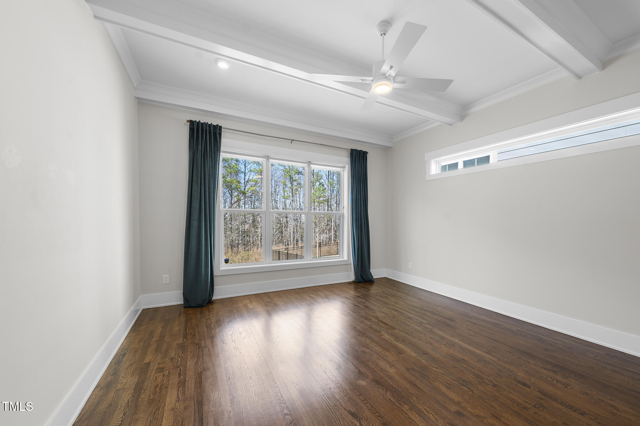 729 Daniel Rdg Road Wendell, NC 27591 - Photo 20 of 57 a view of an empty room with wooden floor and a window