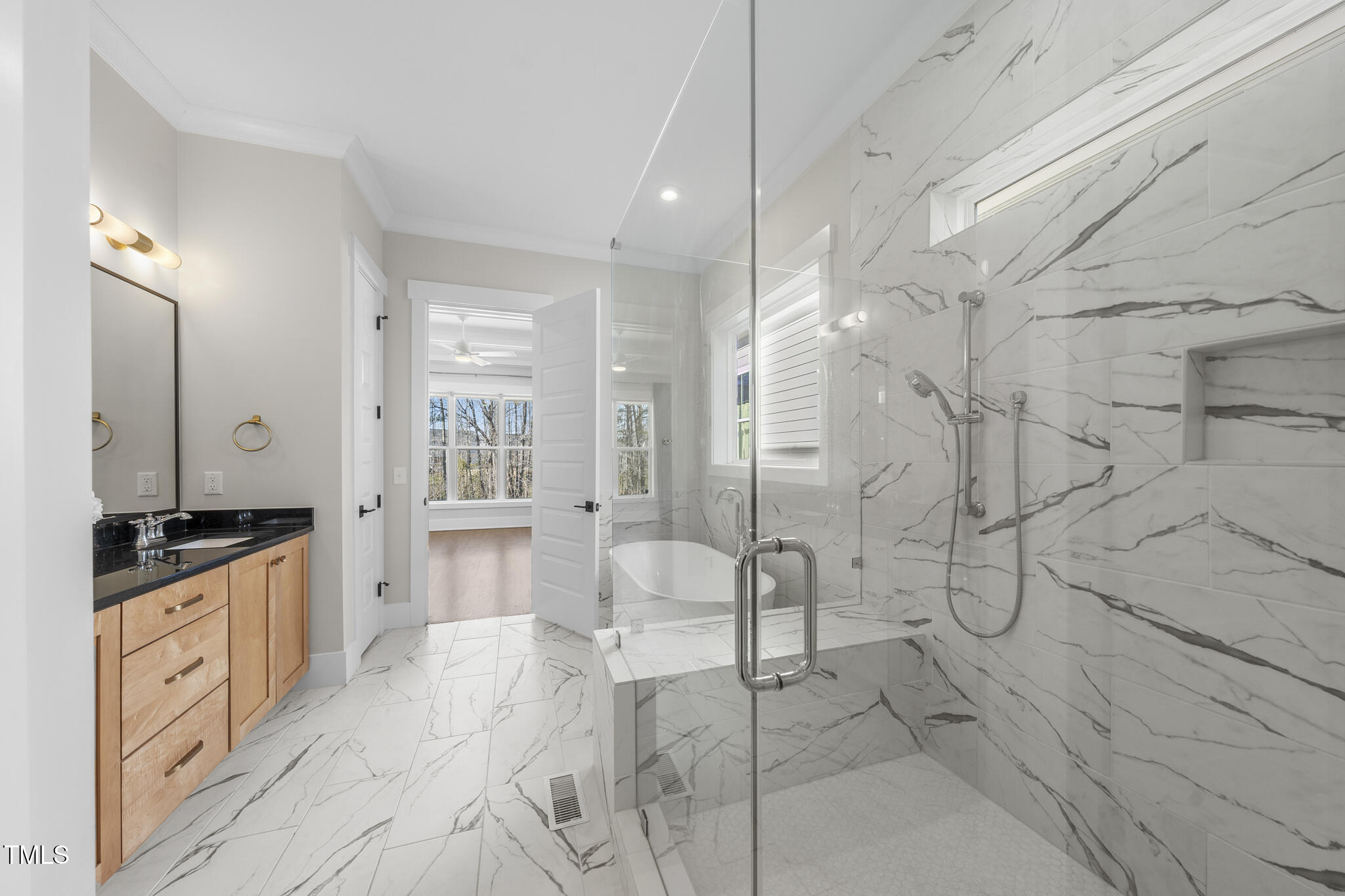 729 Daniel Rdg Road Wendell, NC 27591 - Photo 22 of 57 a spacious bathroom with a granite countertop sink a mirror and shower