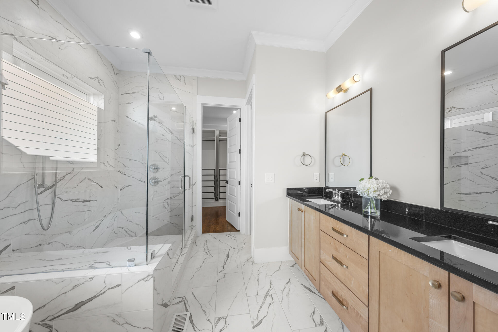 729 Daniel Rdg Road Wendell, NC 27591 - Photo 23 of 57 a spacious bathroom with a granite countertop sink mirror and shower