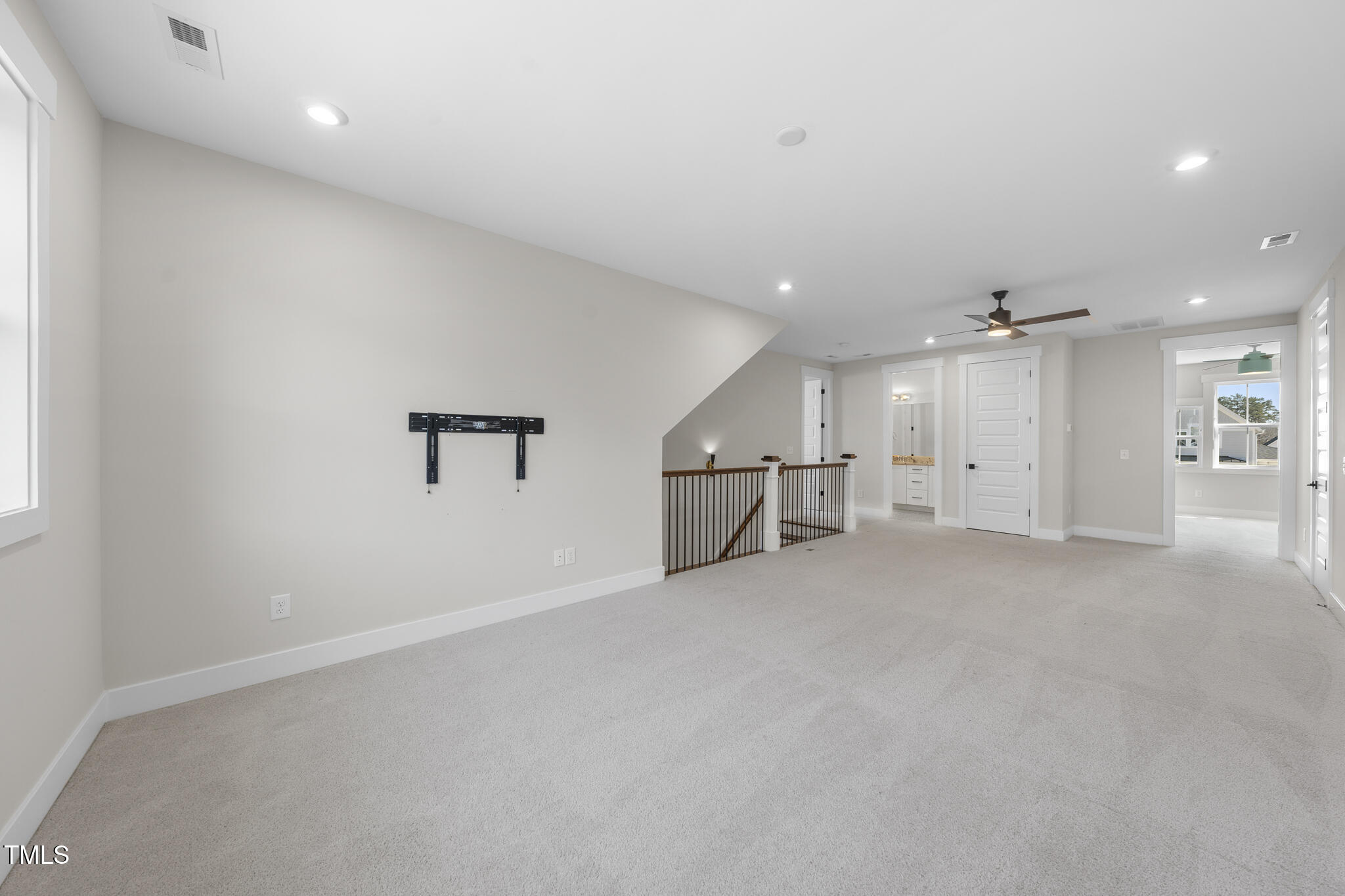 729 Daniel Rdg Road Wendell, NC 27591 - Photo 27 of 57 an empty room with a cabinet and mirrors