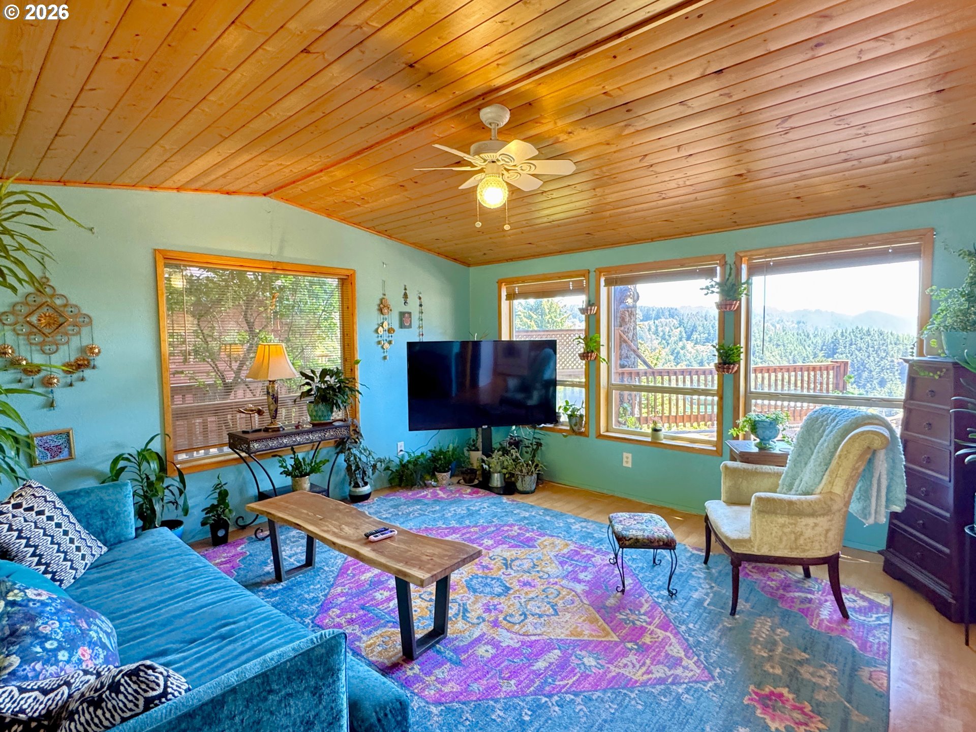 19921 Whaleshead Road, Unit U25 Brookings, OR 97415 - Photo 16 of 47 a living room with furniture a rug and a large window
