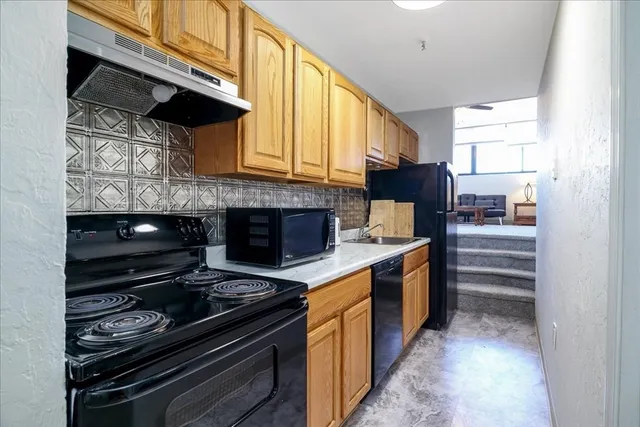 a kitchen with a stove and a microwave