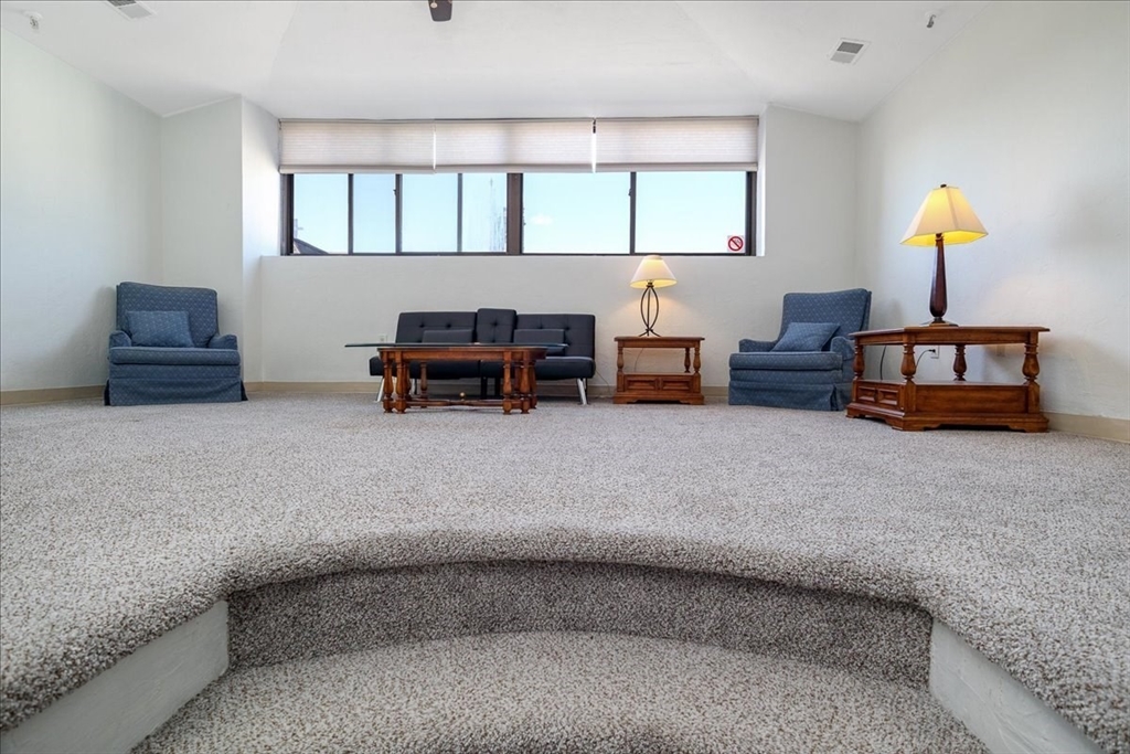 531 Main Street, Unit 503 Worcester, MA 01608 - Photo 3 of 21 a living room with furniture and a window