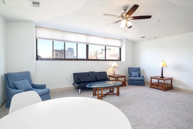 a work room with furniture and a lamp