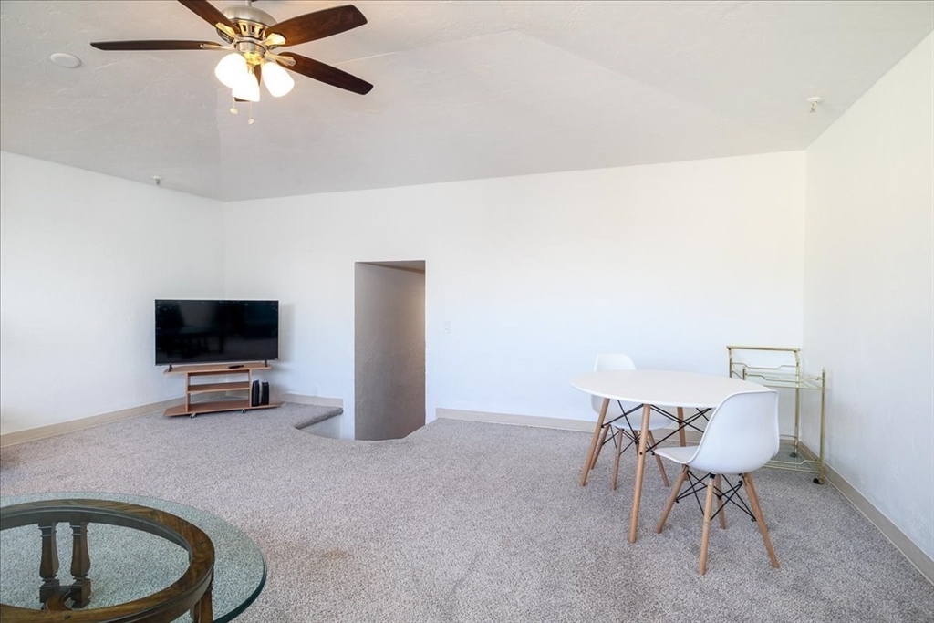 531 Main Street, Unit 503 Worcester, MA 01608 - Photo 7 of 21 a living room with furniture and a flat screen tv