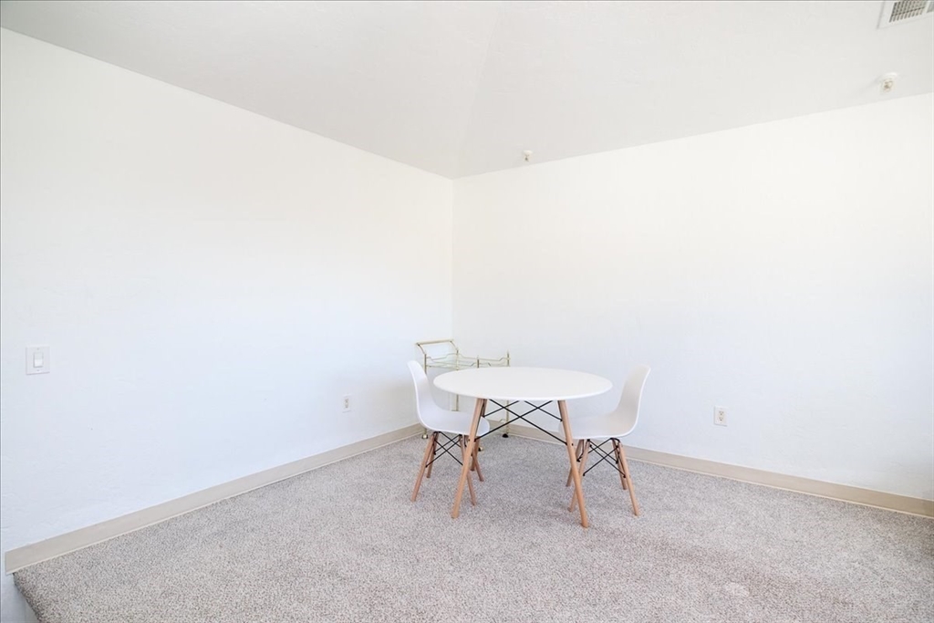 531 Main Street, Unit 503 Worcester, MA 01608 - Photo 8 of 21 a view of a room with a table and chairs