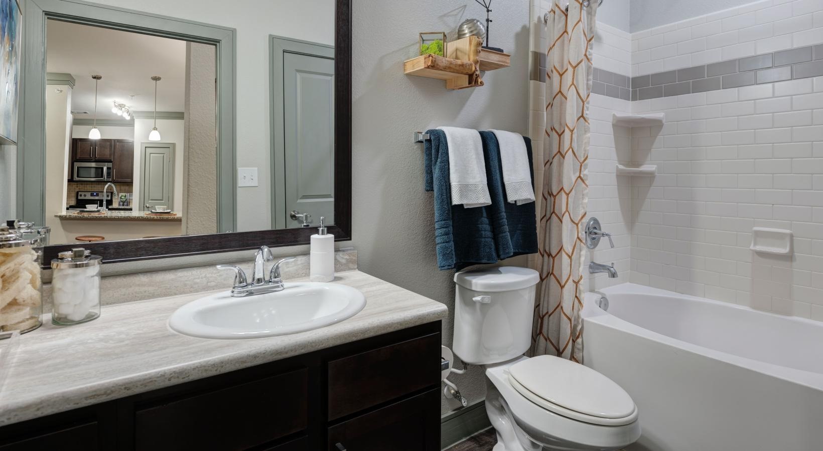 2539 Spring Cypress Road, Unit 6111 Spring, TX 77388 - Photo 12 of 13 a bathroom with a sink a toilet and shower