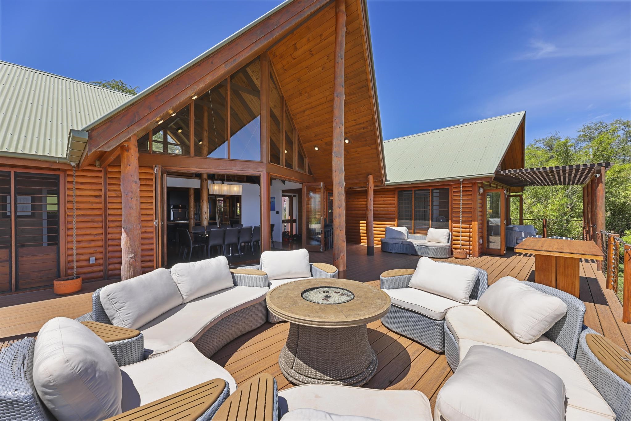122 Ulua Road Kaunakakai, HI 96748 - Photo 16 of 48 a view of a patio with couches table and chairs and potted plants