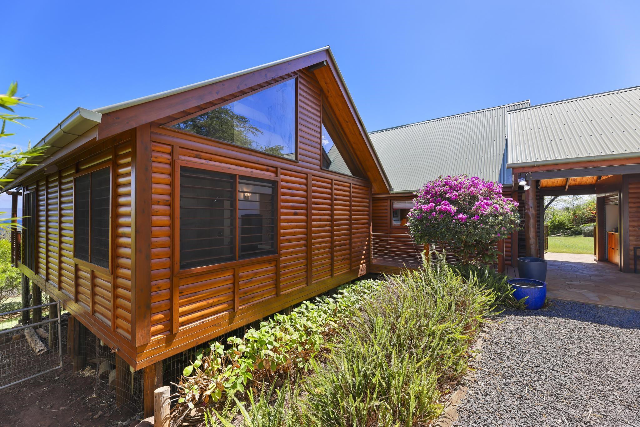 122 Ulua Road Kaunakakai, HI 96748 - Photo 25 of 48 a front view of a house with a yard