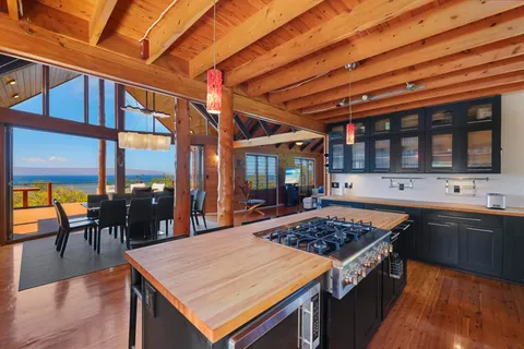 a kitchen with a stove and a table