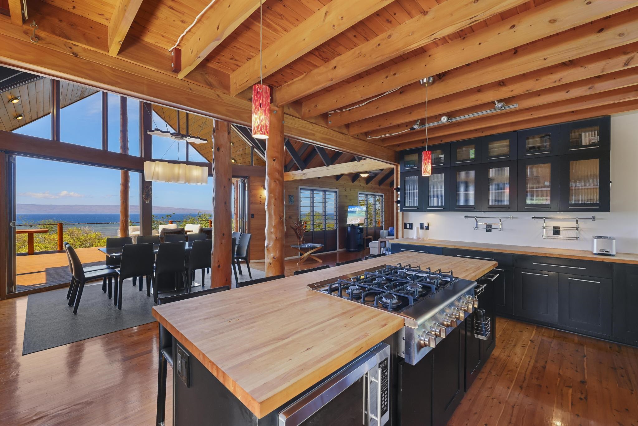 122 Ulua Road Kaunakakai, HI 96748 - Photo 3 of 48 a kitchen with a stove and a table