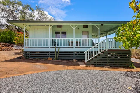 a view of a livingroom with furniture and hardwood floor