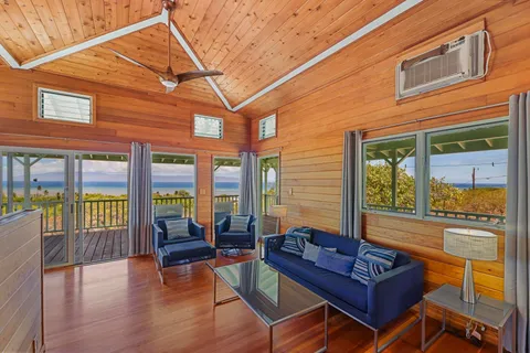a view of a living room with a large window