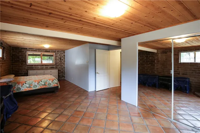 an aerial view of a house with garden space and street view