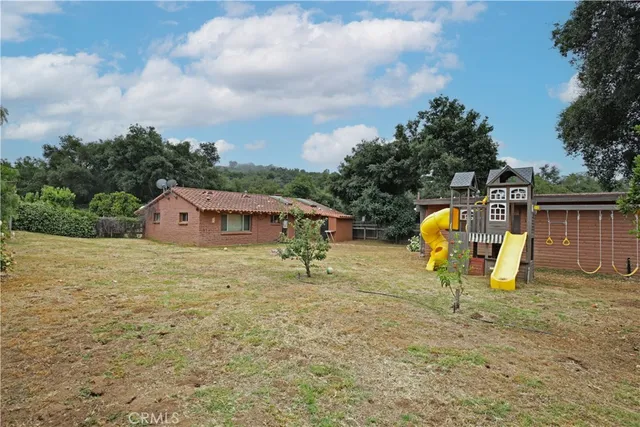 a bathroom with a toilet a sink a shower and a mirror