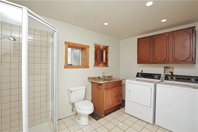 a bathroom with a shower and a sink