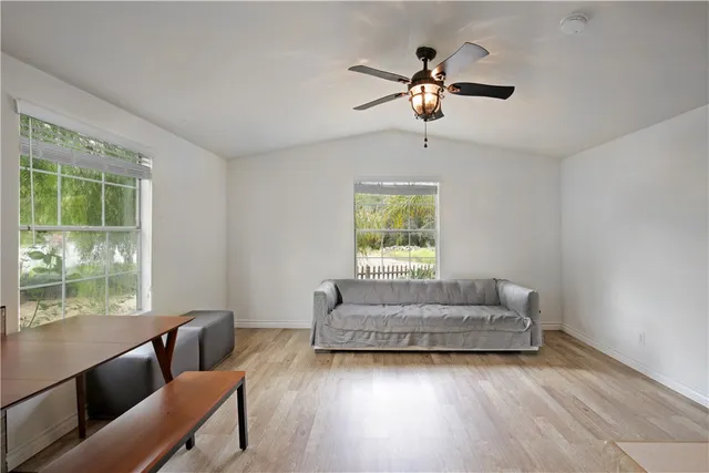 an aerial view of a houses with yard