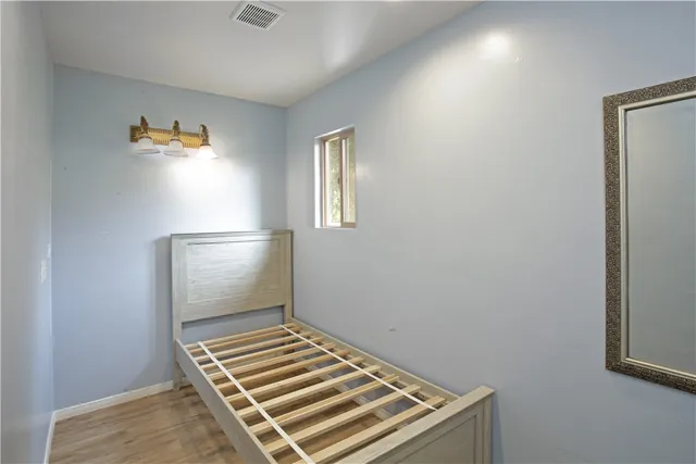 an aerial view of house with yard and mountain view in back