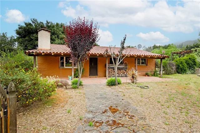 a bathroom with a sink mirror vanity and toilet