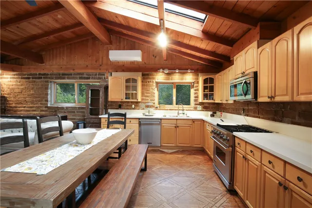 a house view with a garden space and sitting space